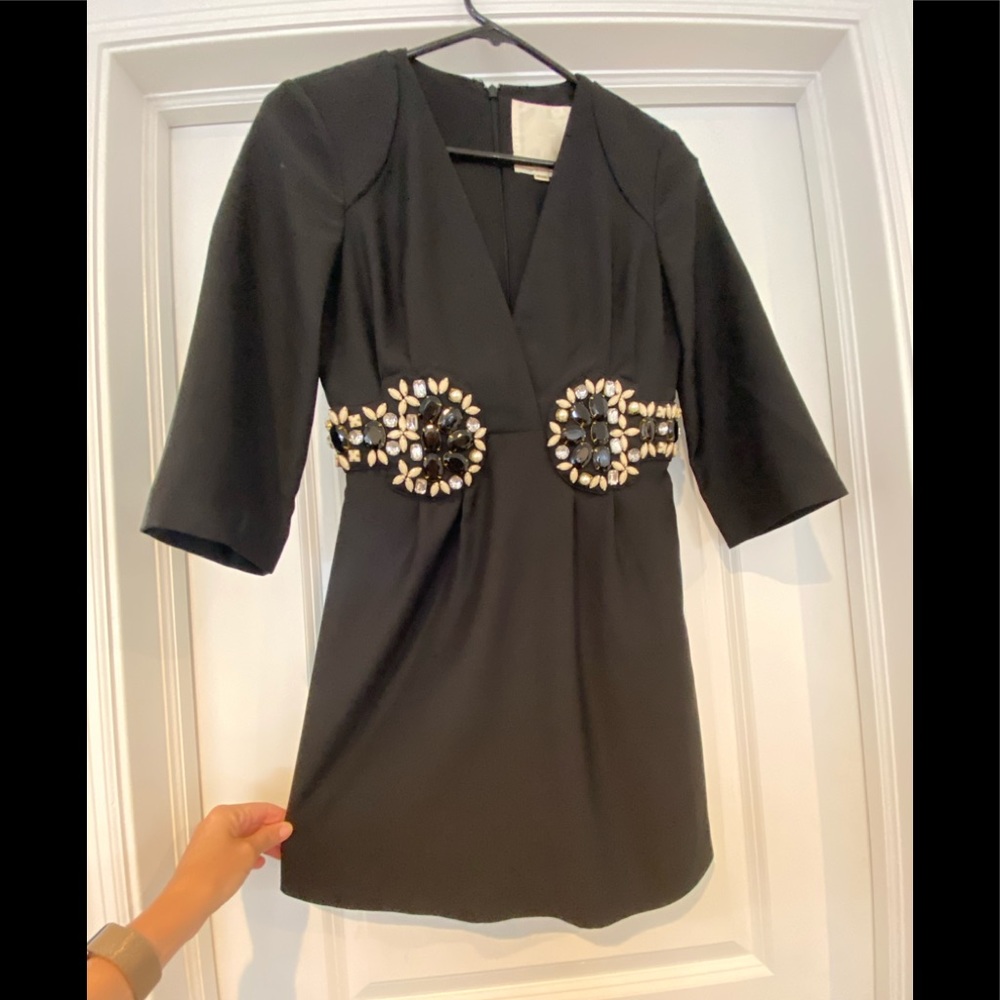 Black mini dress with jeweled belt look.